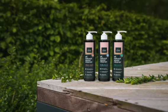 Bottles of cleaning product are shown on a terrace outside