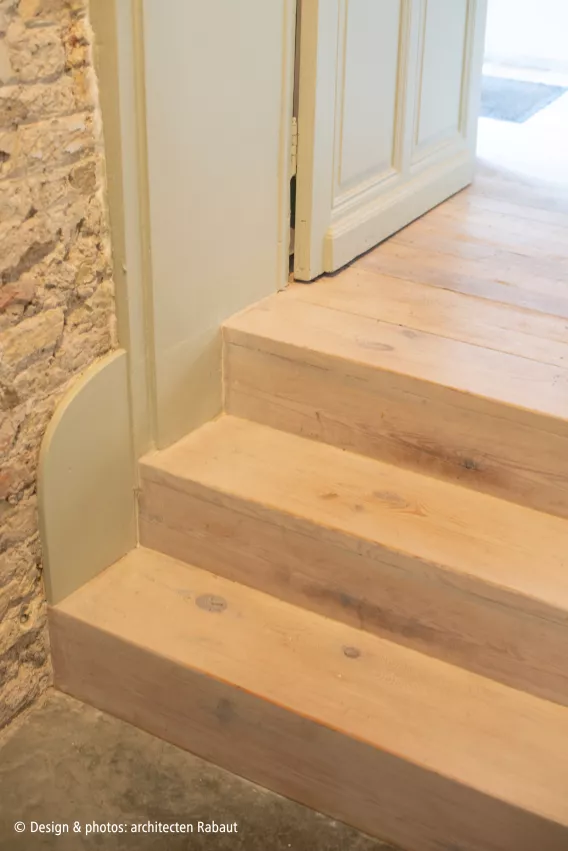 Three staircase steps between rooms
