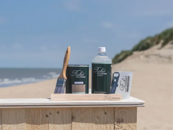 Products of WoodCream range on a bar on the beach