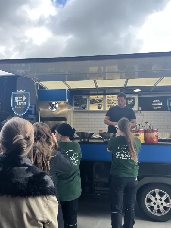 Employees are lining up at a fries stand