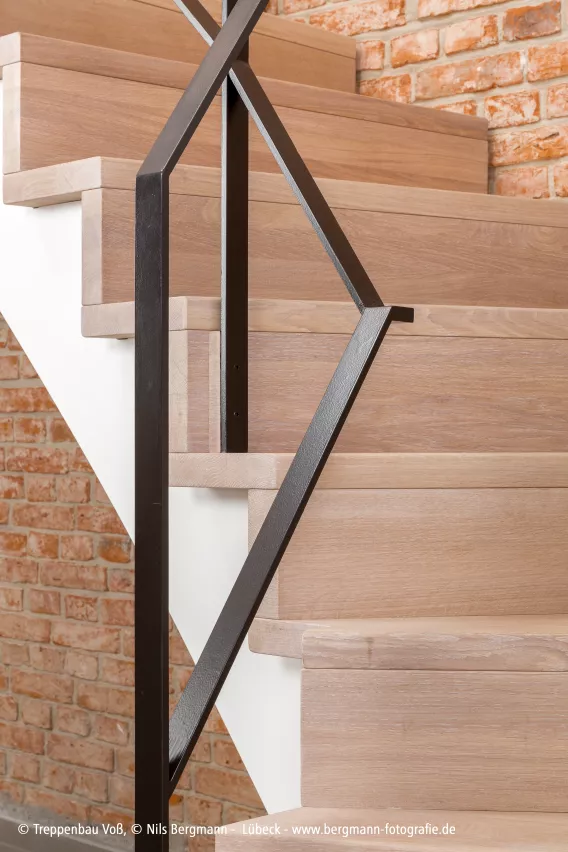 Detail shot of light staircase with metal balluster