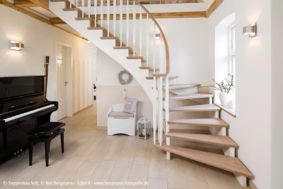 Floating staircase in big entry hall with piano