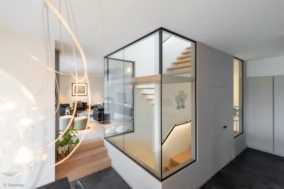 Floating staircase in a glass hallway