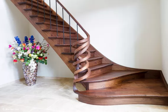 Staircase with artful swirling newel post